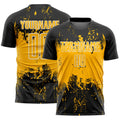 Custom Black Gold-White Abstract Splatter Grunge Art Sports Sublimation Soccer Uniform Jersey