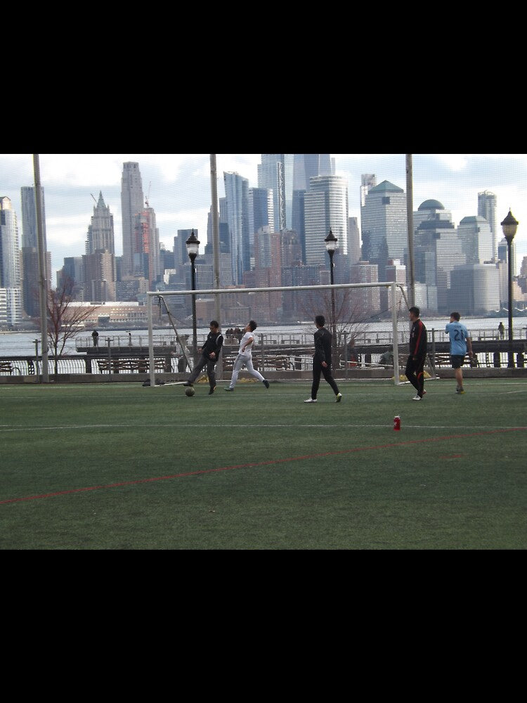 Playing Soccer (Football) Along the Hudson River, Manhattan Skyline, Hoboken, New Jersey by lenspiro
